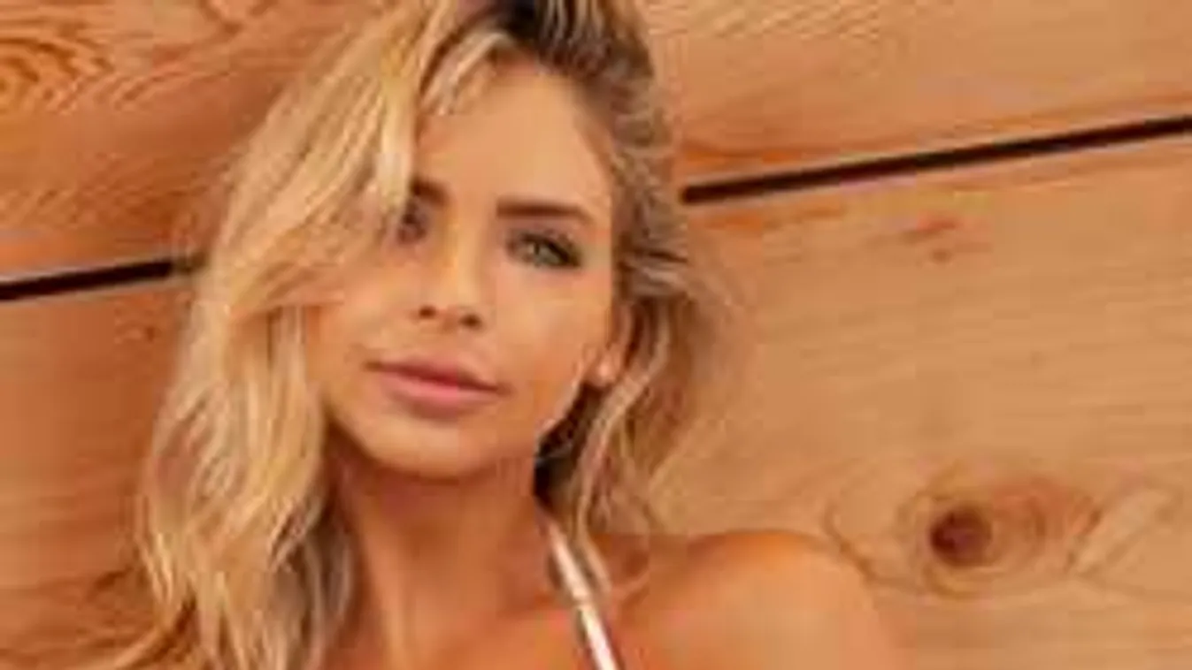 Félmeztelenül eszik dinnyét a gömbölyű keblű sportolónő