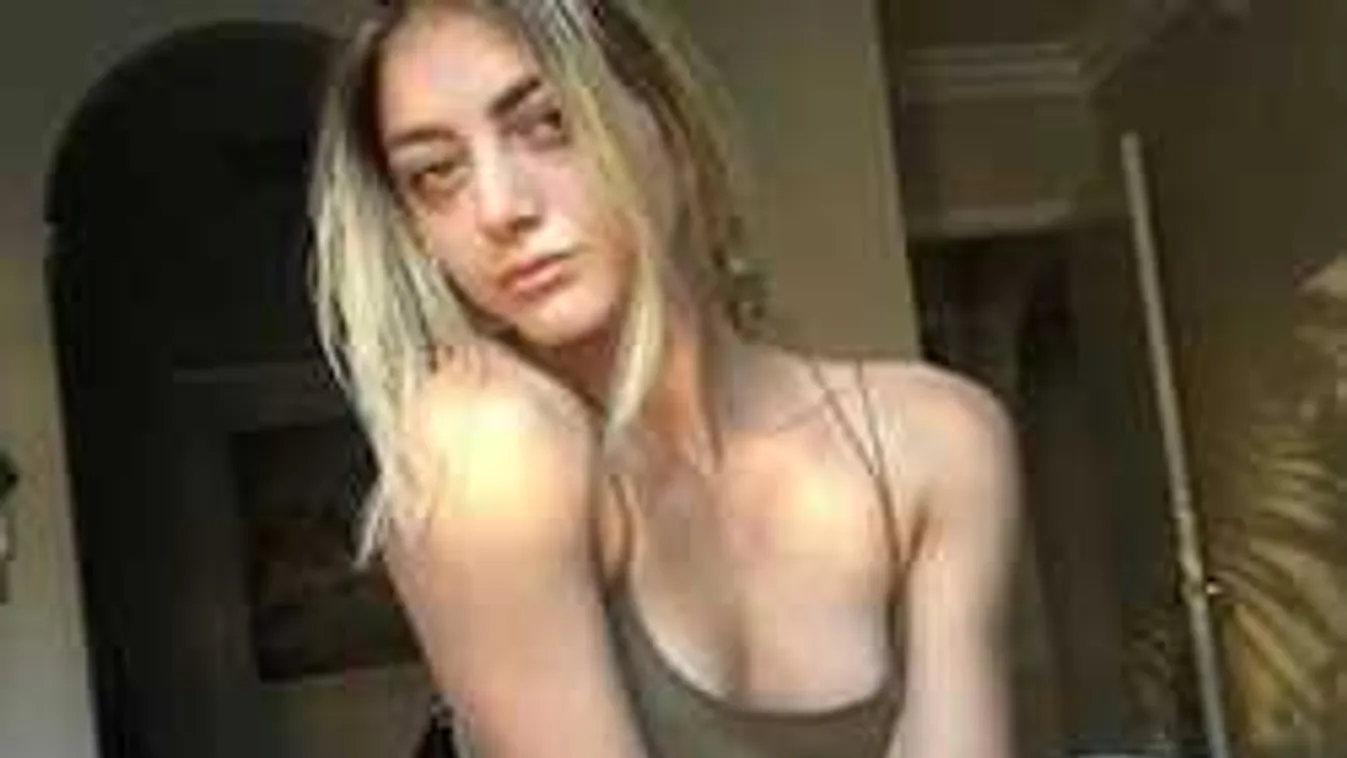 A belvárosi társasház parkolójában tornázott meztelenül a fiatal lány!