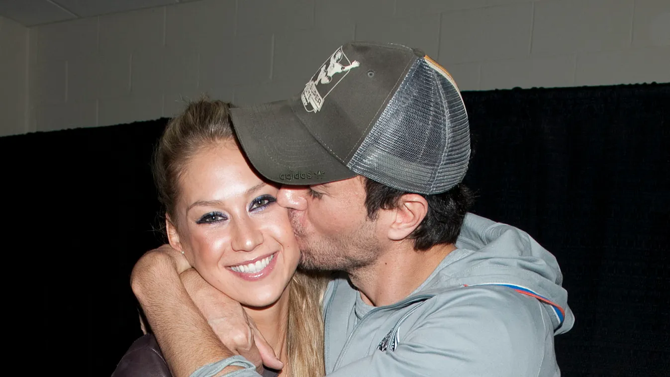 Enrique Iglesias and his girlfriend, tennis star, Anna Kournikova hang out backstage in the Just Jared lounge at the Y100 Jingle Ball on December 11, 2010 in Miami, Florida.