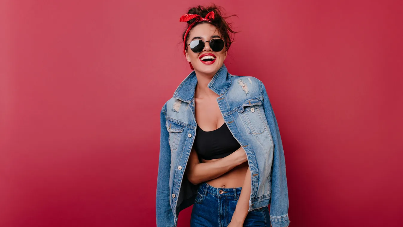 Pleased,Girl,Wears,Jeans,Laughing,On,Claret,Background.,Spectacular,Female