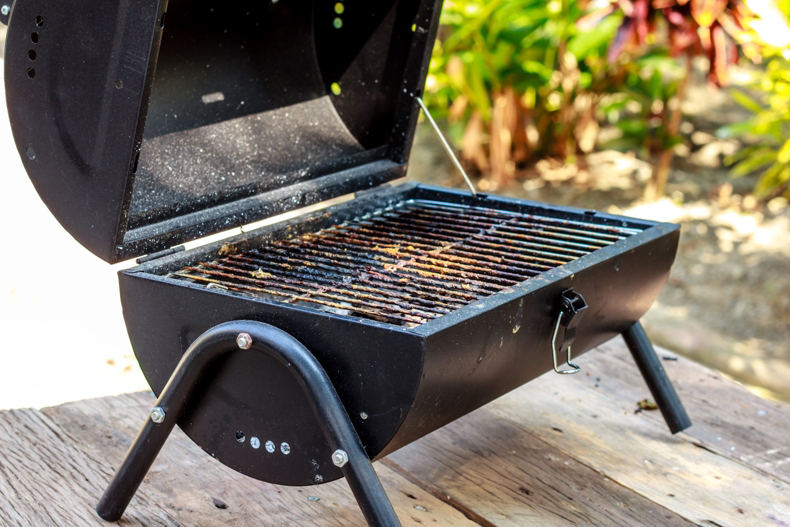 The,Portable,Barbecue,On,The,Wooden,Table