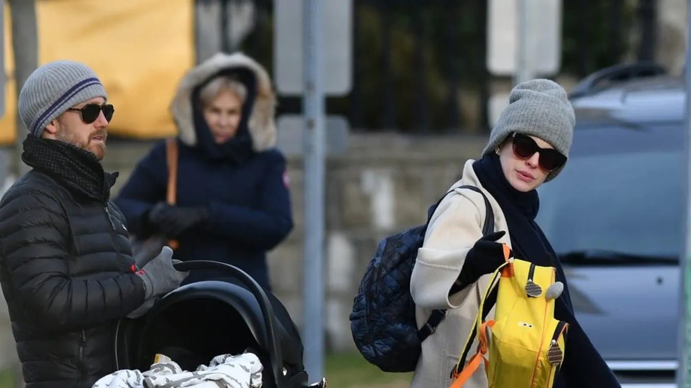 EXCLUSIVE: Anne Hathaway Steps Out with Adam Shulman Holding a Bassinet in Connecticut.