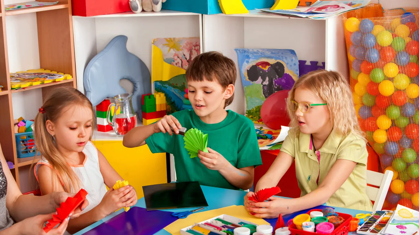 School,Children,With,Scissors,In,Kids,Hands,Cutting,Paper,With