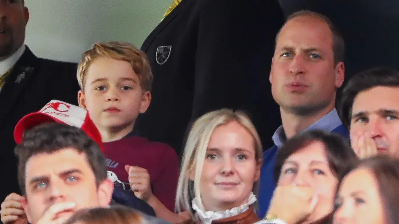 Prince William, Duke of Cambridge and Catherine, Duchess of Cambridge watch football with children.