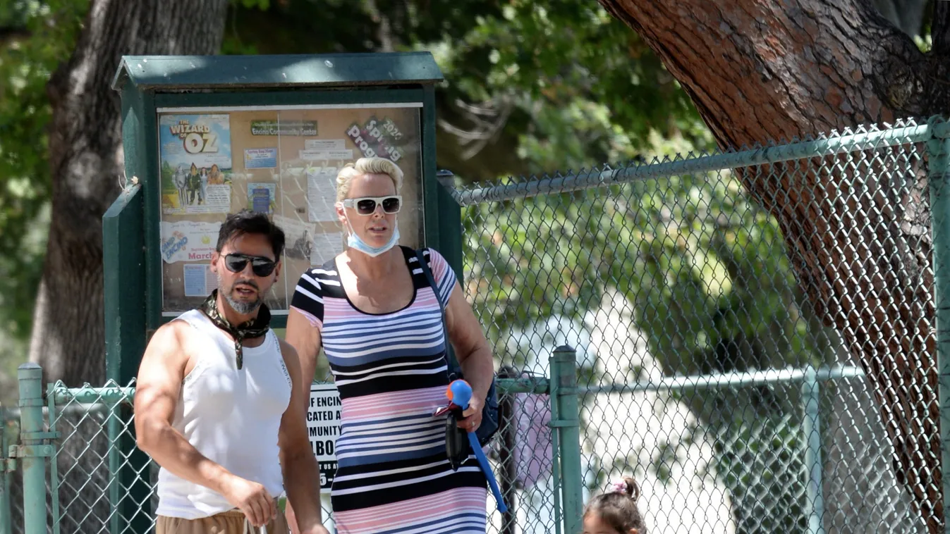 Brigitte Nielsen makes a tight squeeze in a closure park