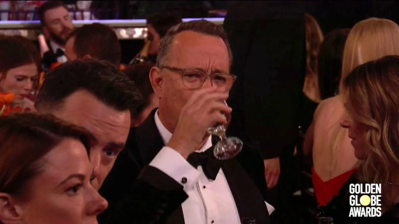 Tom Hanks hilariously shows off his cough and cold medicine at the Golden Globe Awards