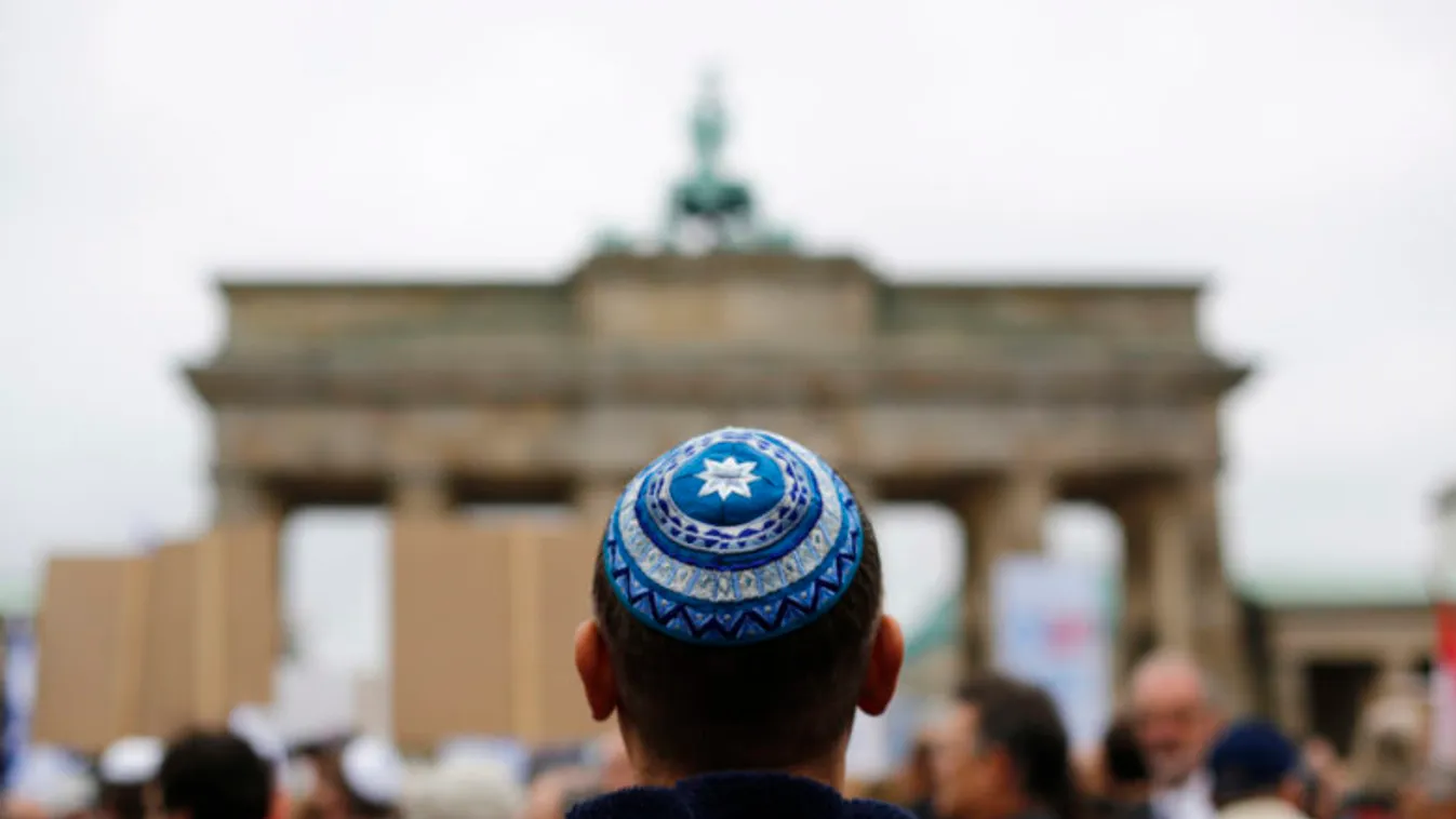 A man wearing a kippah waits for the start of an anti-Semitism demo at Berlin's Brandenburg Gate