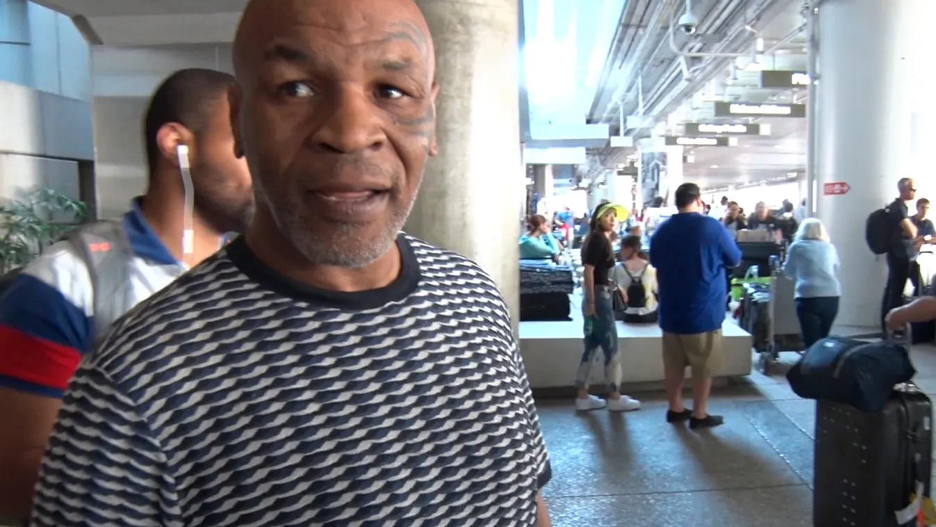 PREMIUM EXCLUSIVE Mike Tyson Lands At LAX After Addressing Rapper Lil Nas X's Fight Challenge