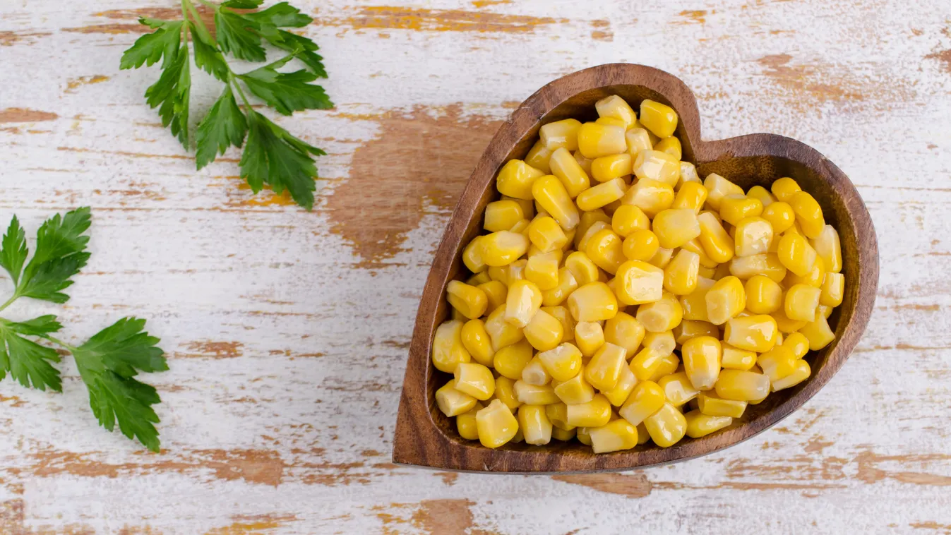Sweet,Canned,Corn,In,A,Dish,On,A,Wooden,Background.