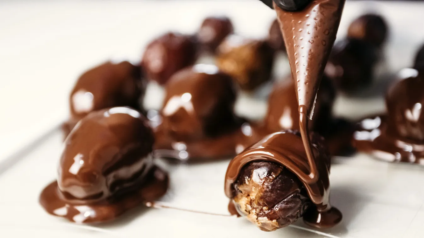 Dates,In,Chocolate,,Dessert.,Confectioner,Pours,Chocolate,Over,Dessert.,Macro,