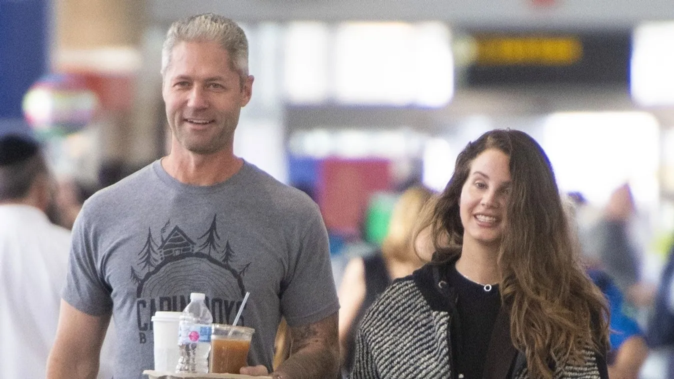 *EXCLUSIVE* Lana Del Rey and cop boyfriend Sean Larkin are totally into each other as they arrive at JFK airport in NYC