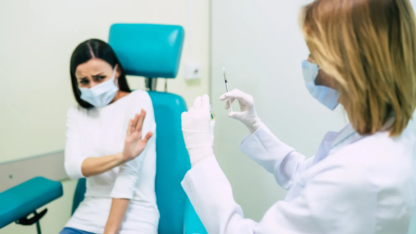 No,Vaccination.,Scared,Woman,Gesturing,Stop,To,Hand,Offering,Syringe