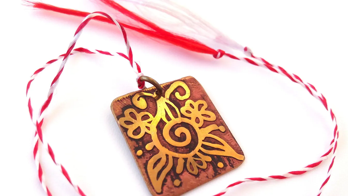 Golden,Metal,Pendant,With,Floral,Design,And,A,Red,And