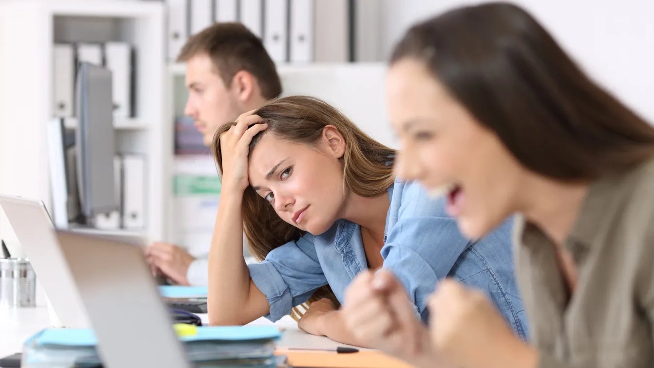 Worried,Worker,Beside,A,Successful,One,Who,Is,Excited,Reading