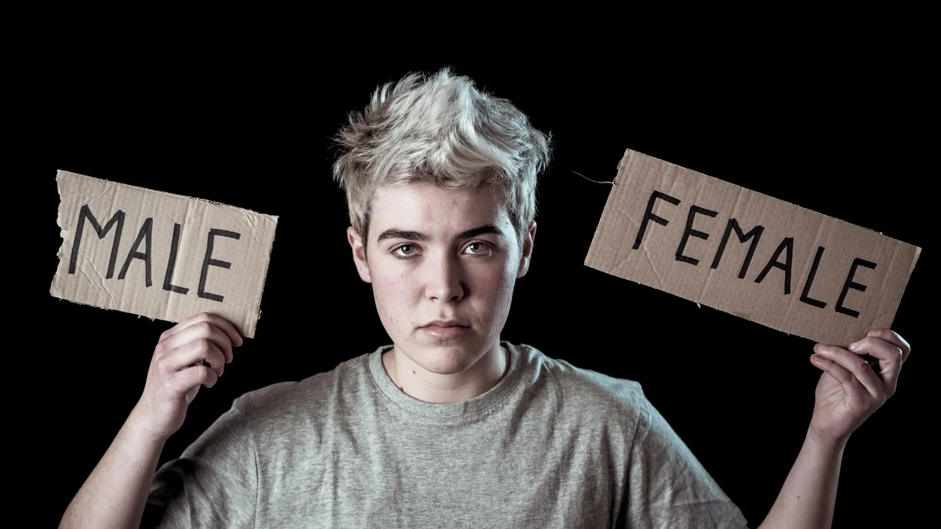 Handsome,Transgender,Teenager,Tearing,The,Word,Female,Into,Male,In