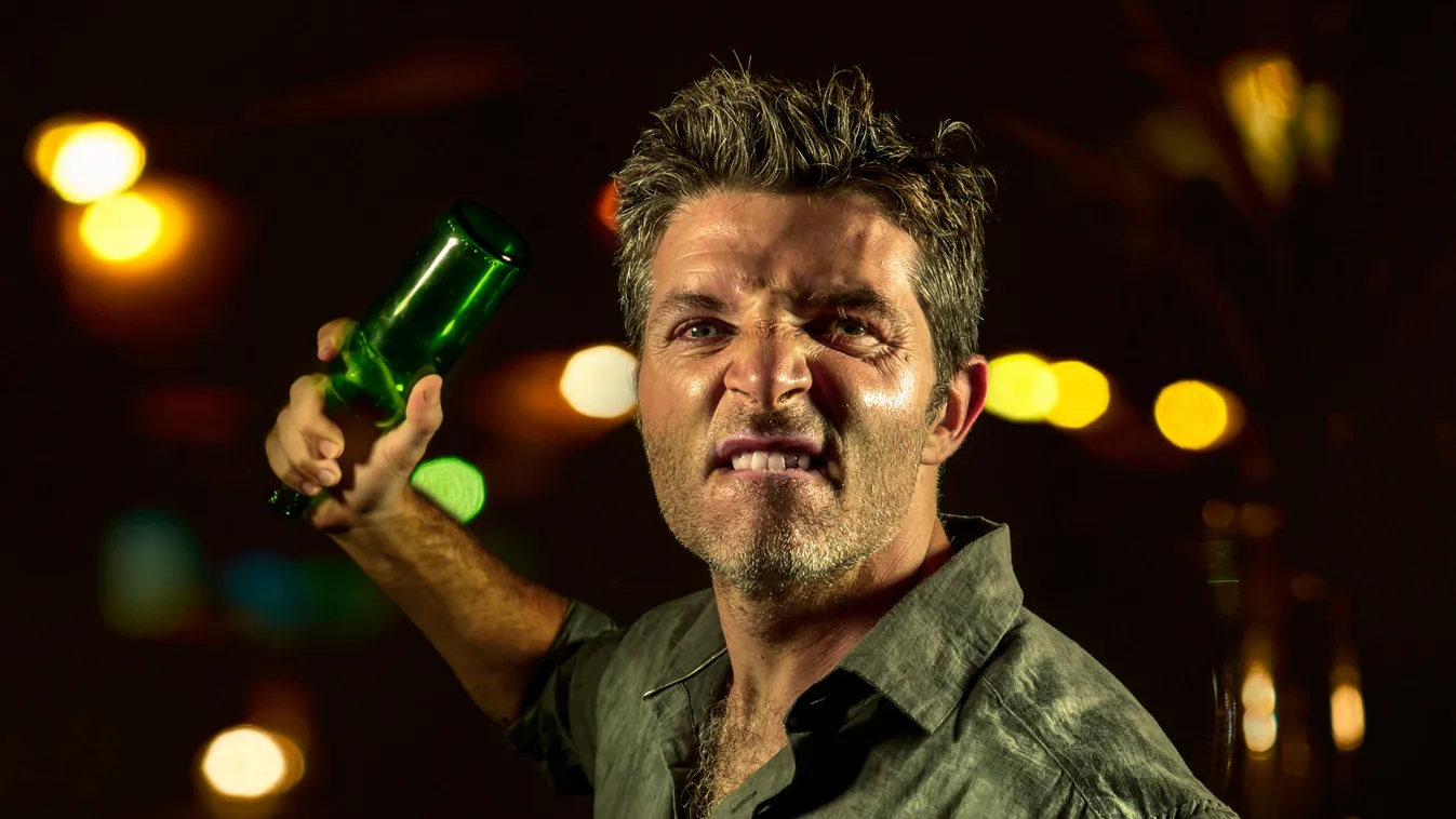 Young,Upset,And,Aggressive,Drunk,Man,In,Pub,At,Night