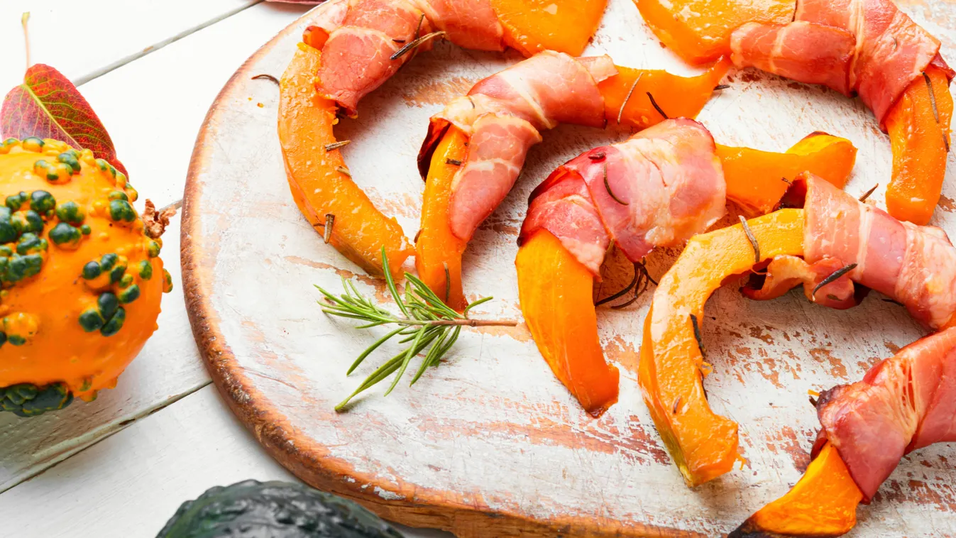 Baked,Pumpkin,Slices,Wrapped,In,Bacon,On,Kitchen,Board