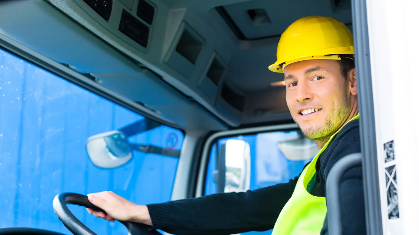 builder driving with truck of construction site