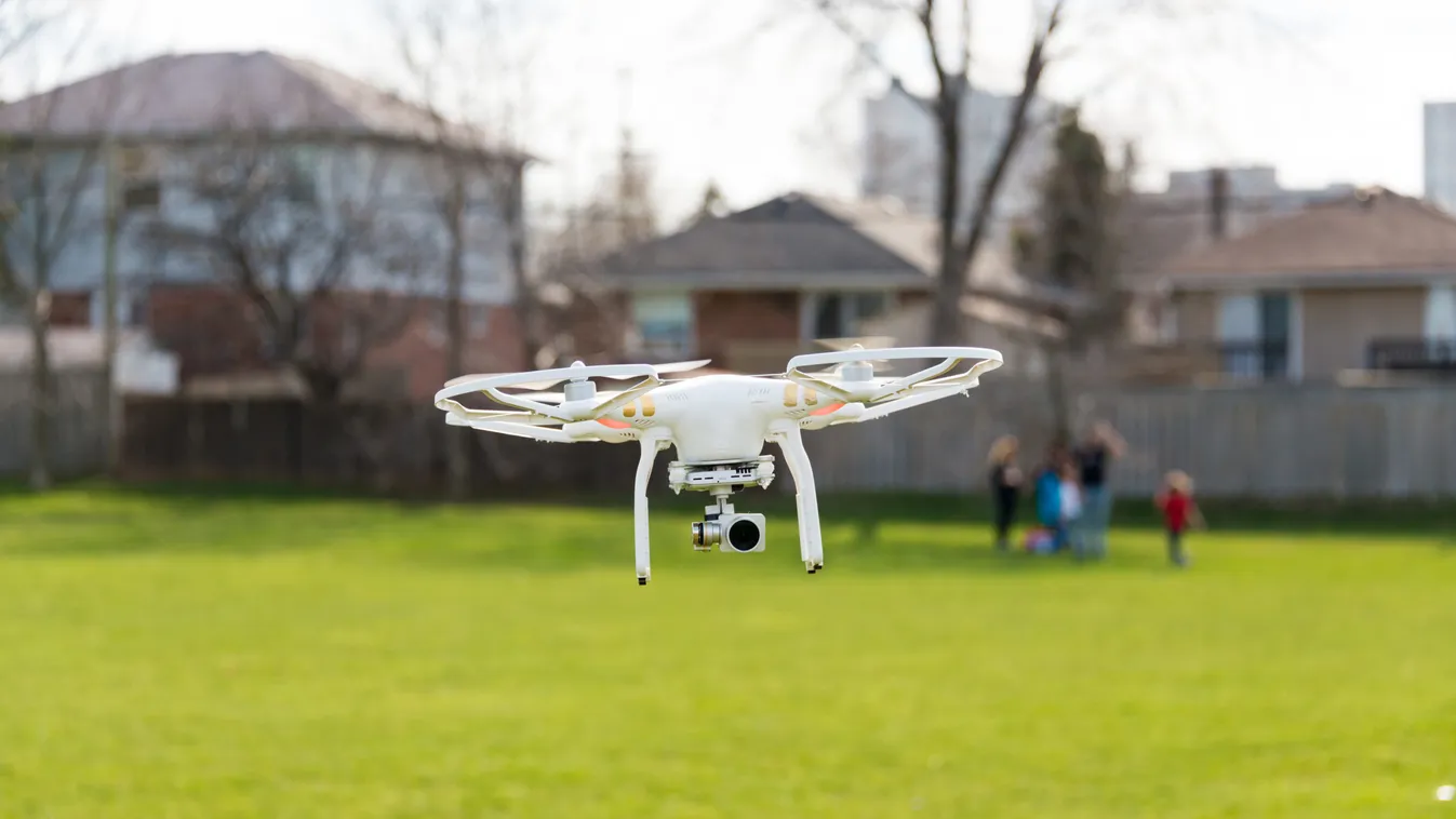 Quadcopter Drone With Camera Flying In Yard