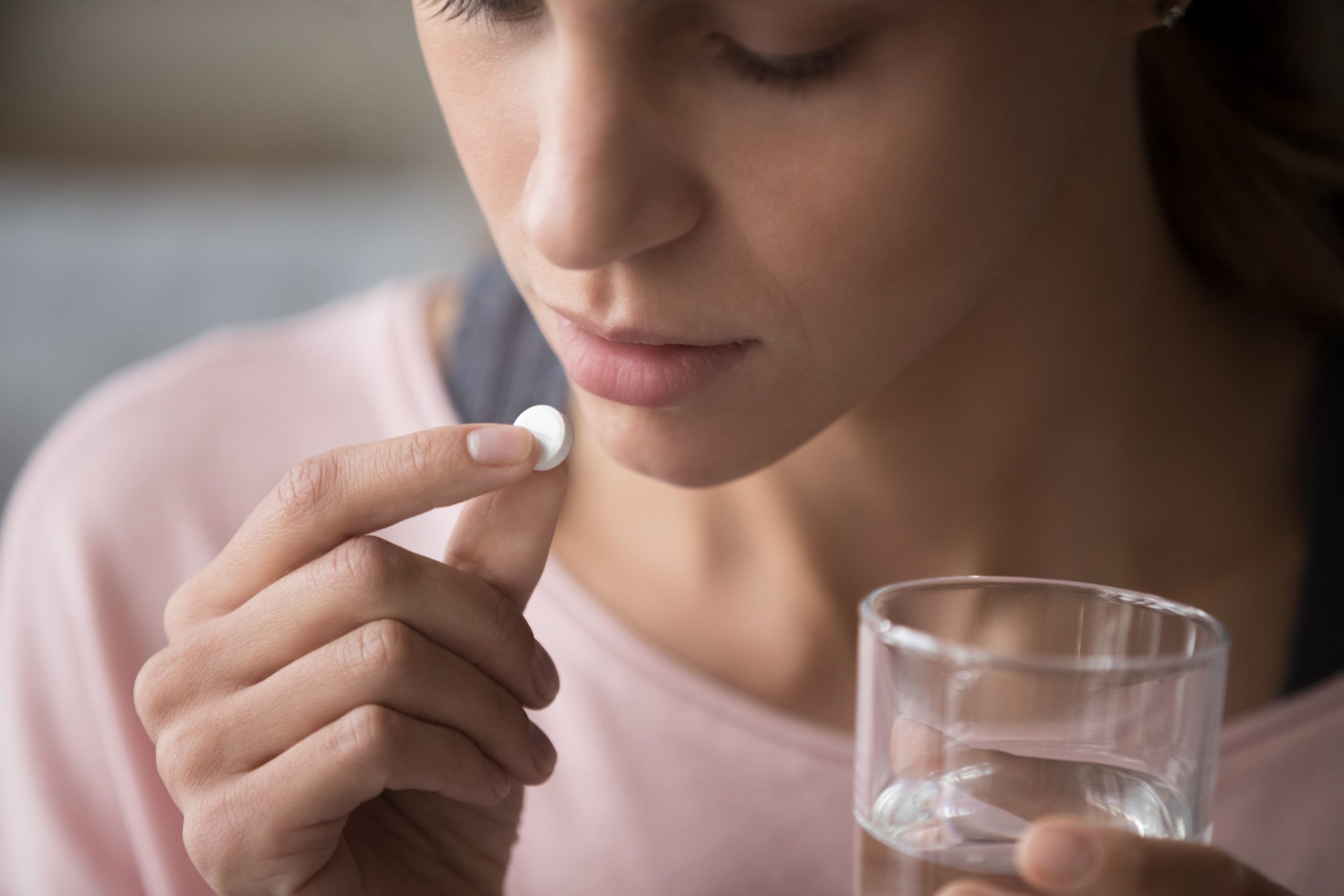 Close,Up,Cropped,Image,Millennial,Mixed,Race,Girl,Holding,Pill