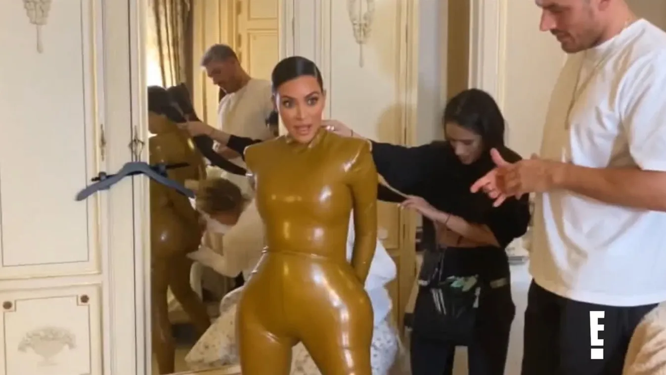 Kim Kardashian struggles to squeeze into a super tight latex outfit in clip for new season of Keeping Up With The :Kardashians