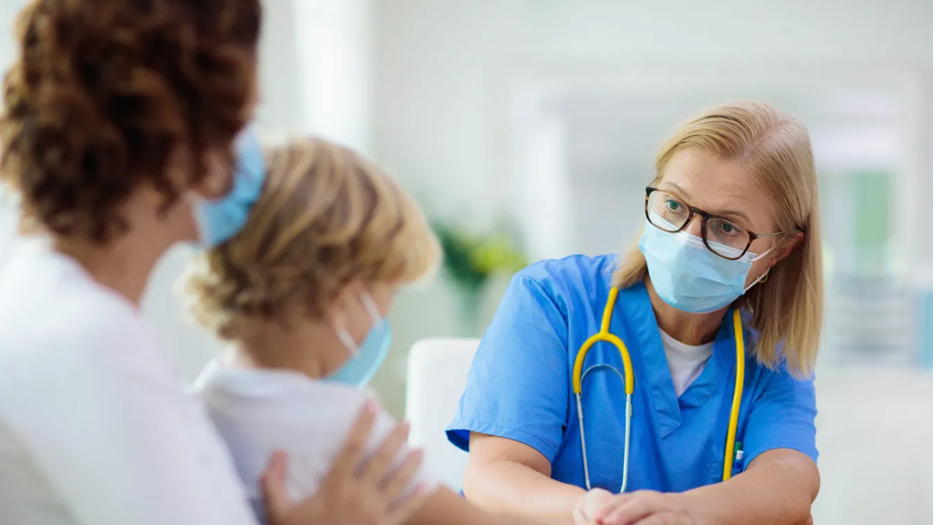 Pediatrician,Doctor,Examining,Sick,Child,In,Face,Mask.,Ill,Boy
