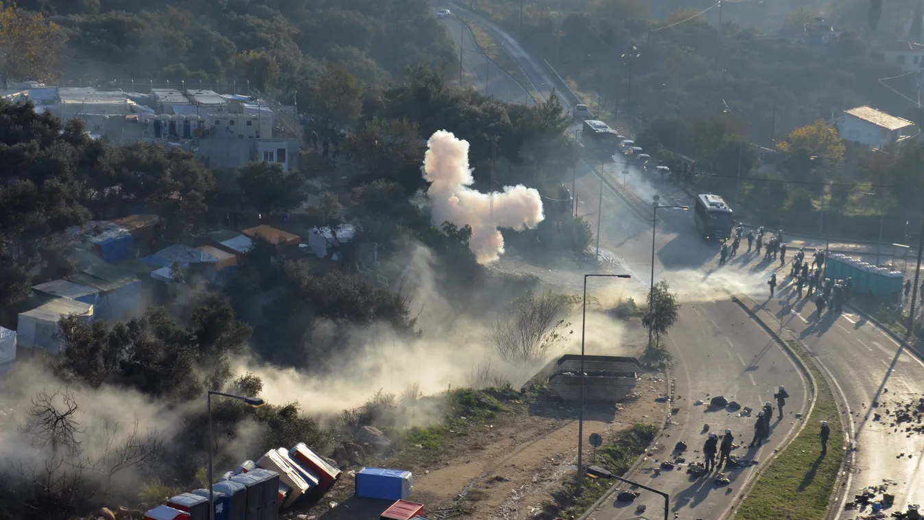 Smoke from tear gas canisters rises next to a camp for refugees and migrants, during clashes between migrants and riot police, on the island of Samos