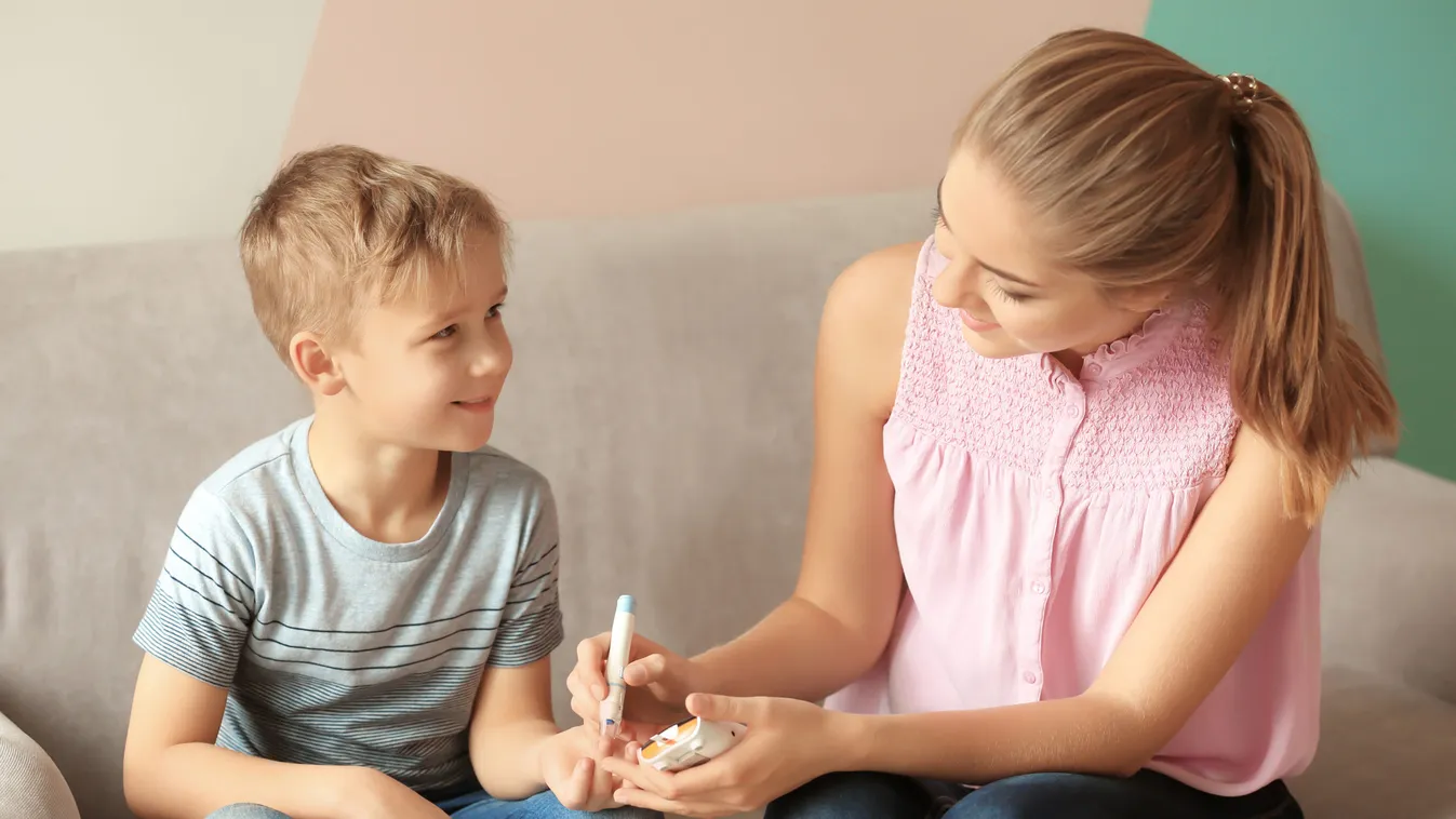 Woman,And,Her,Diabetic,Son,With,Lancet,Pen,And,Digital