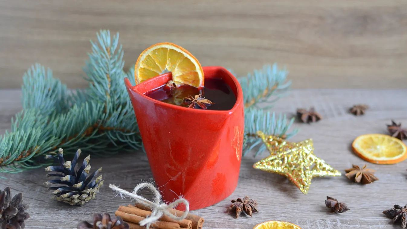 Cup,Of,Hot,Wine,With,Christmas,Decorations,On,Wooden,Table