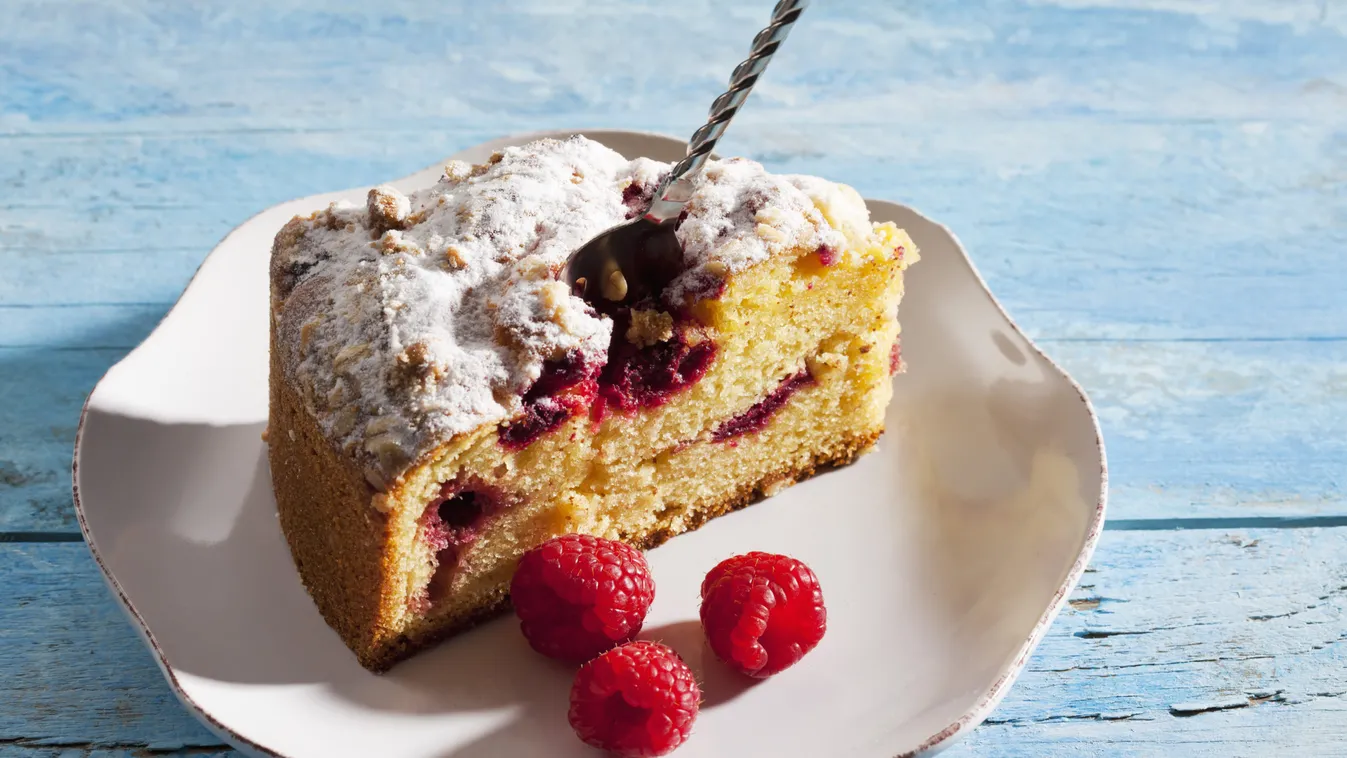 Raspberry,Cake,And,Raspberries,On,Plate,,Blue,Wood