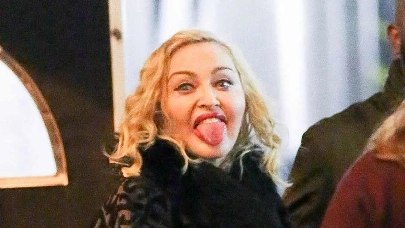 *EXCLUSIVE* Madonna gets playful and sticks her tongue out as she exits Chicago Theater
