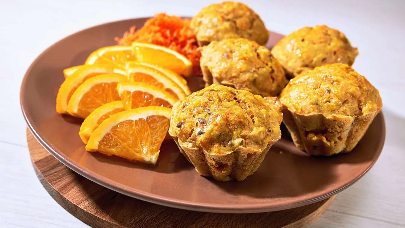 Carotte,Muffins,Served,On,The,Plate,With,Orange,Slices.