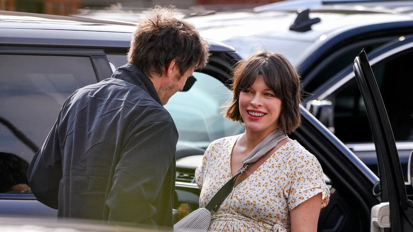 EXCLUSIVE: Milla Jovovich Shows Her Growing Baby Bump while out to Eat in Los Angeles.