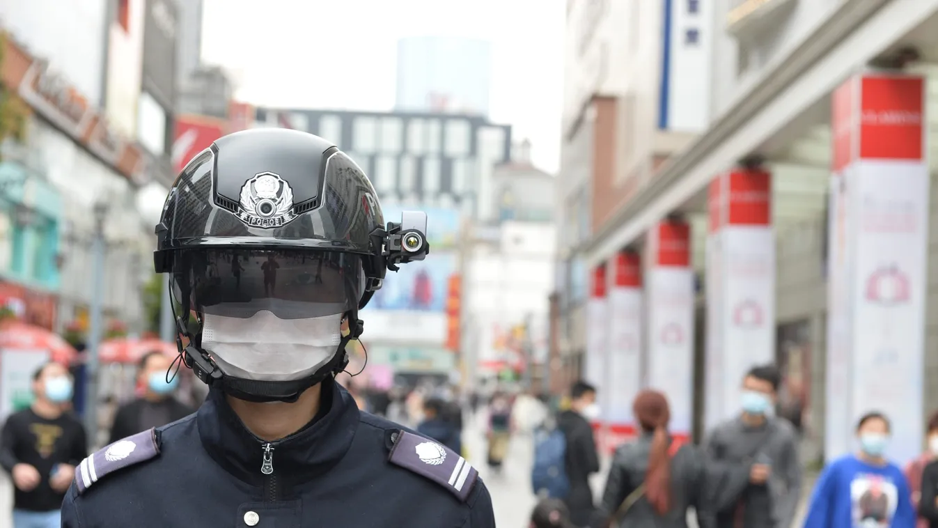 Smart helmet used to monitor people's temperature in SW China