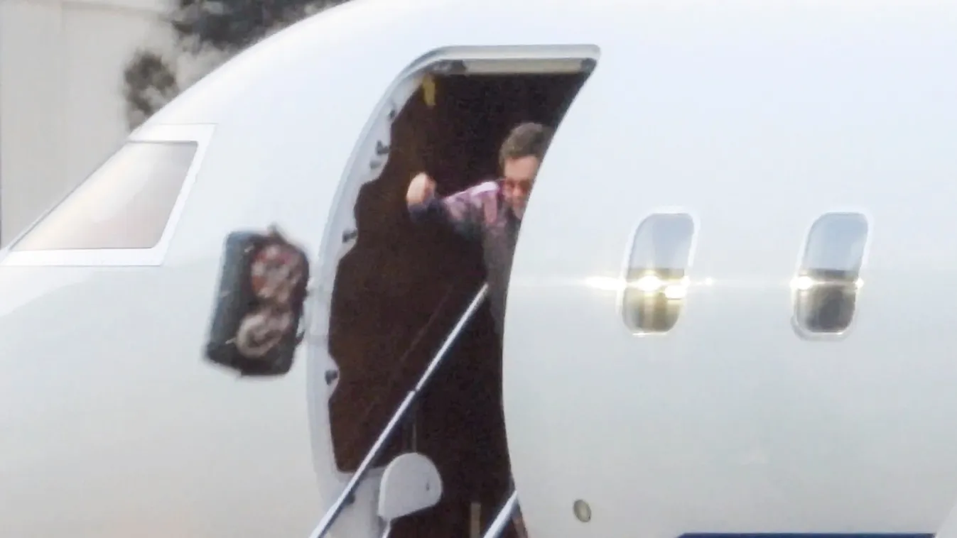 EXCLUSIVE: *NO MAIL ONLINE* Elton John Has A Bit Of DIVA Moment As He Throws His Handbag Off His Private Jet Upon Arrival At Sydney Airport.