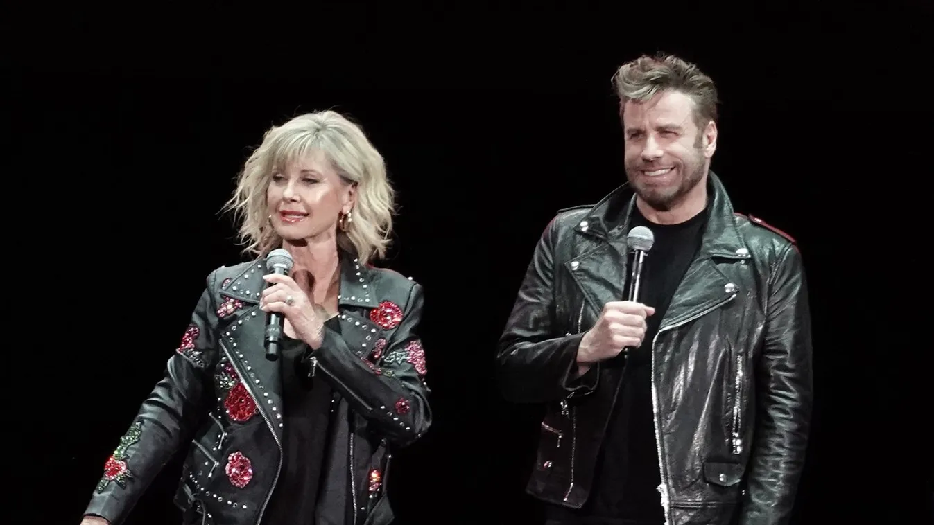 John Travolta and Olivia Newton John recreate their iconic Grease characters in full costume at a Meet N Grease sing-a-long in West Palm Beach