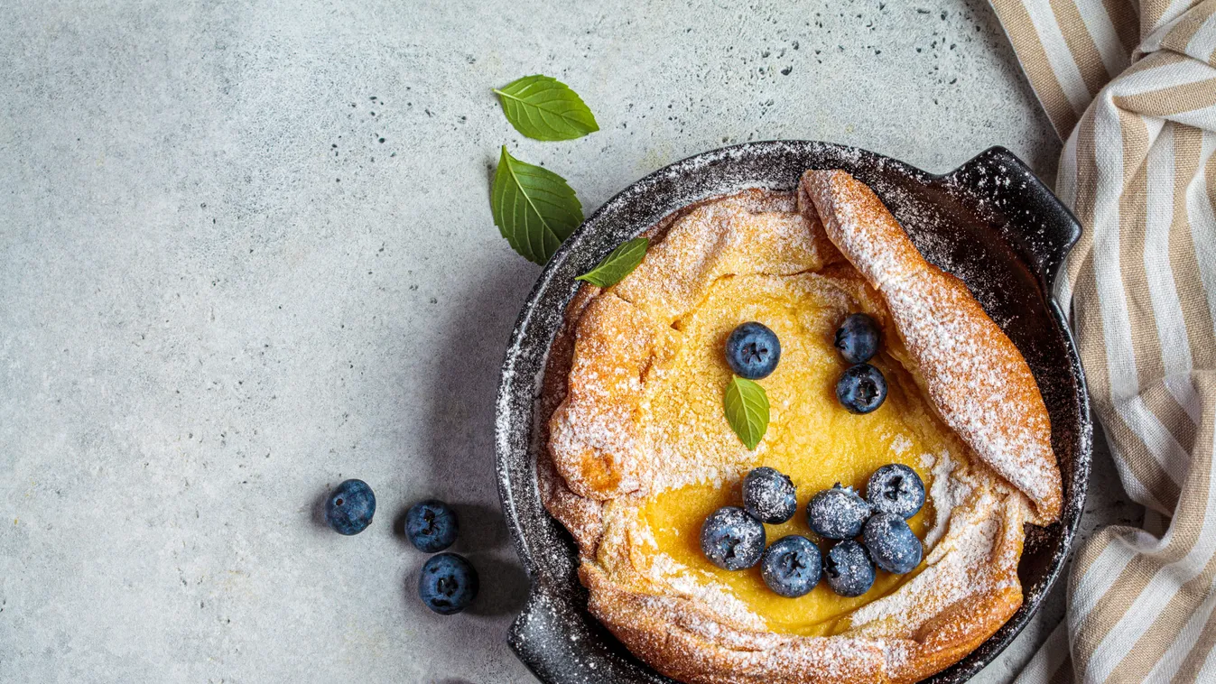Dutch,Baby,Pancake,With,Berries,And,Icing,Sugar,In,A