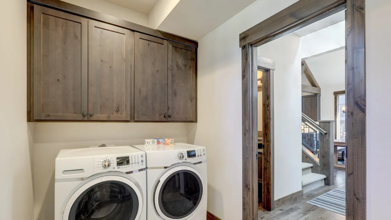 Laundry,Room,With,White,Wahser,And,Dryer,And,Dark,Brown