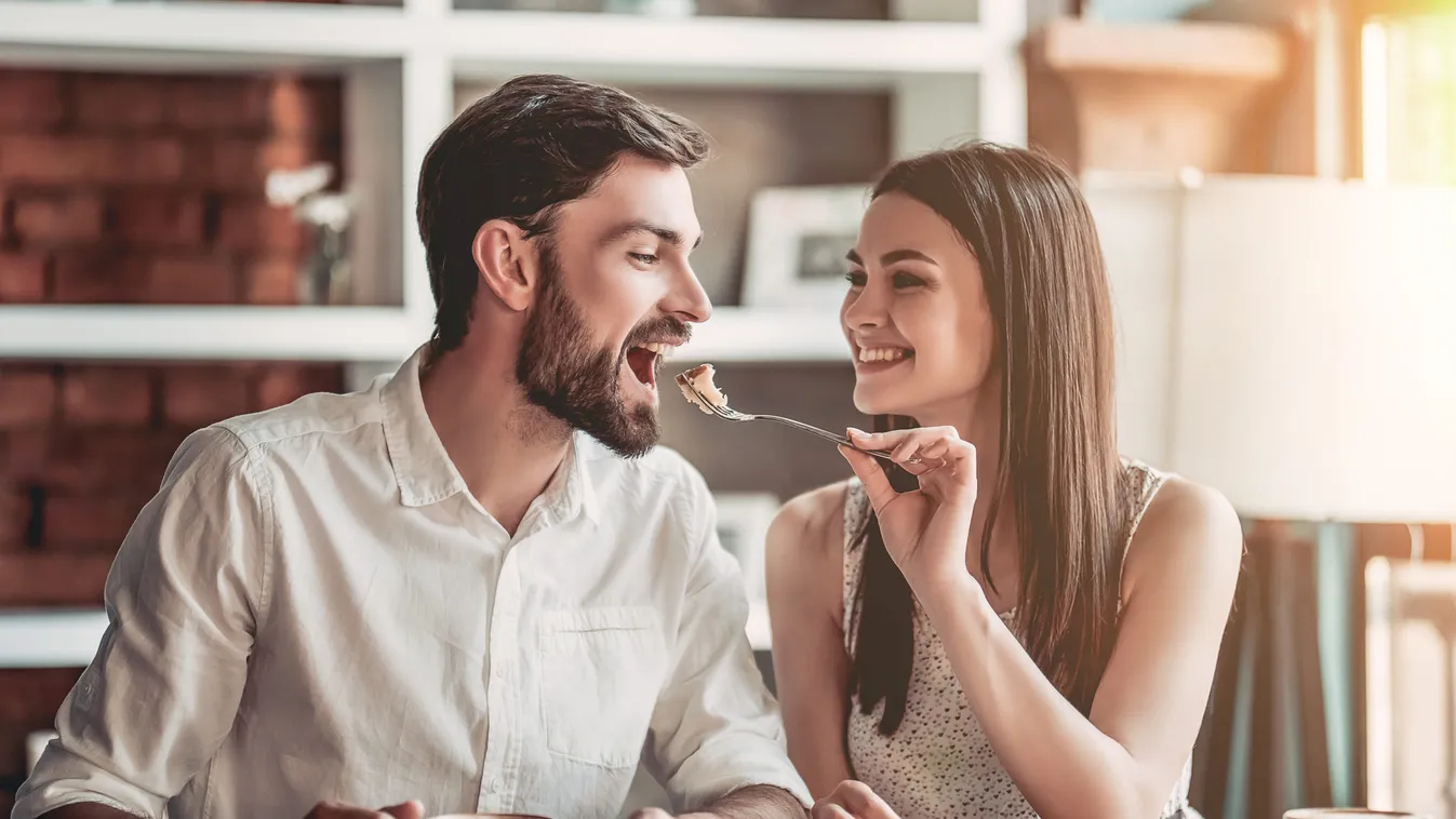 Beautiful,Couple,In,Love,Is,Sitting,In,Cafe,,Drinking,Coffee
