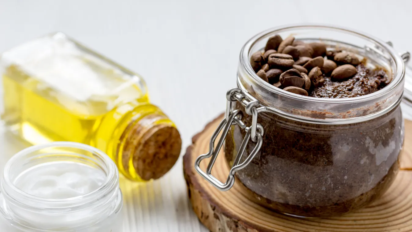 homemade coffe scrub in glass jar on wooden background