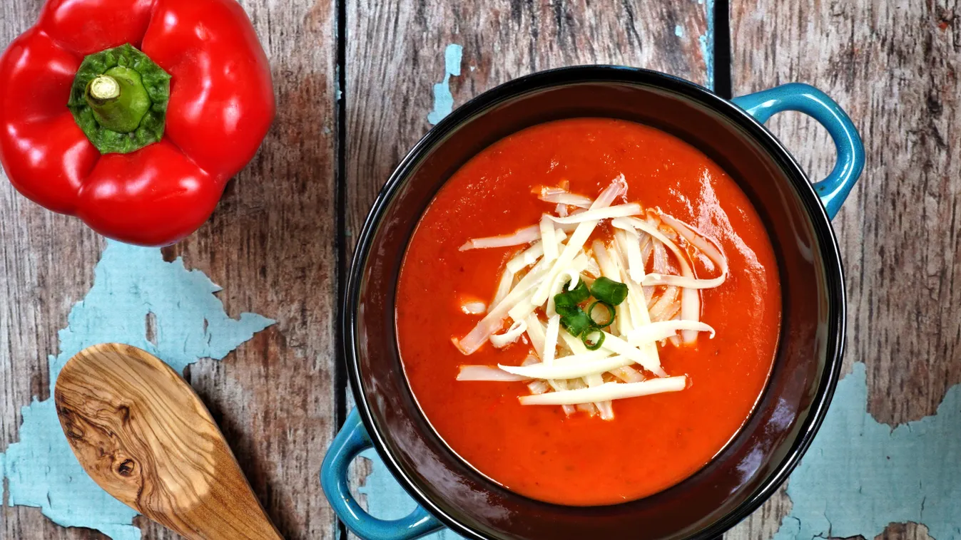 Red,Pepper,Soup,Topped,With,Shredded,Cheese,And,Green,Onions,