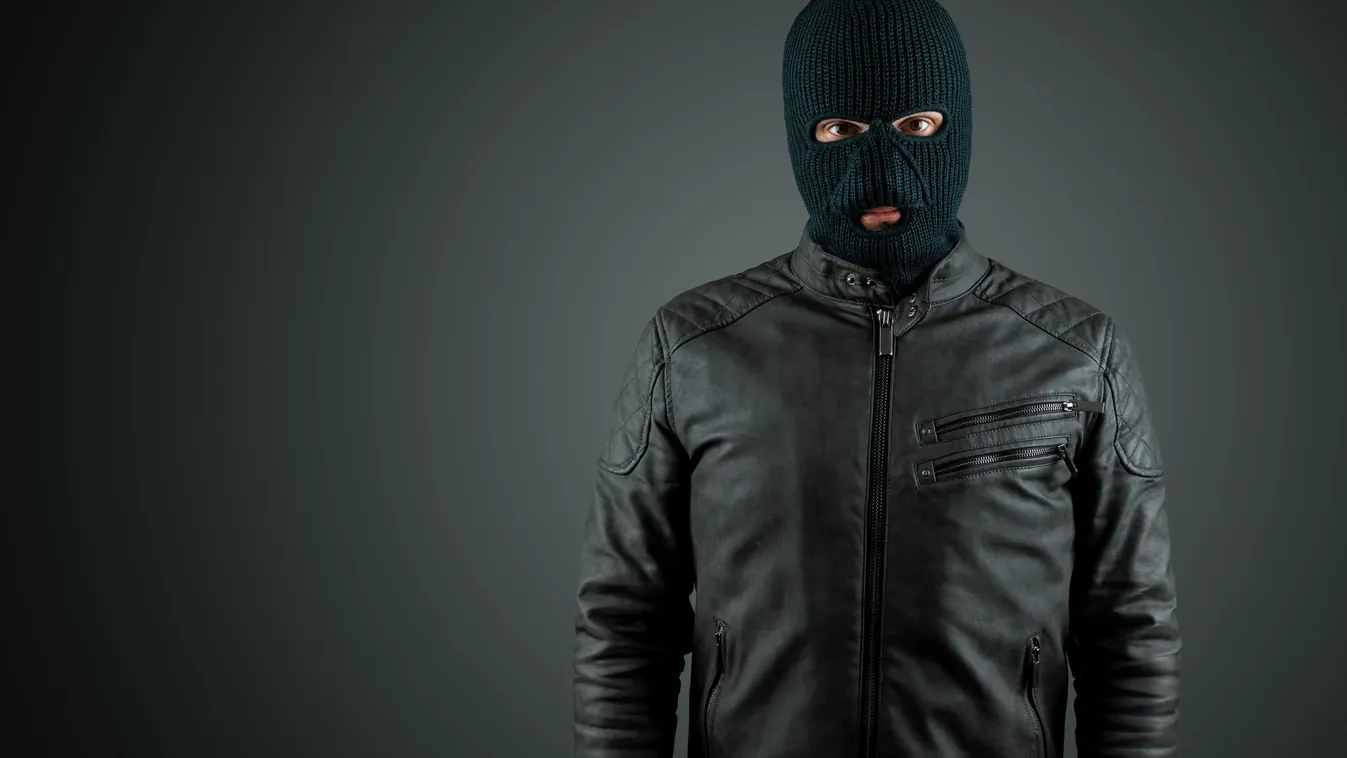 Robber,,Thug,In,A,Balaclava,On,A,Black,Background.,Robbery,