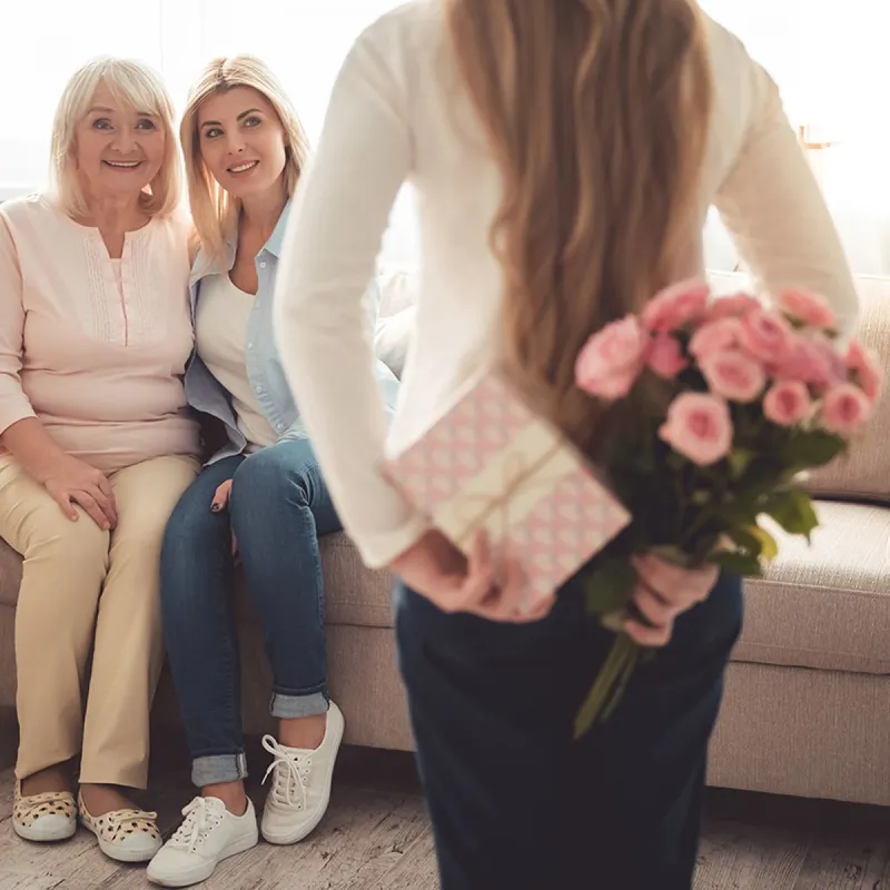 Cute,Teenage,Girl,Is,Hiding,Flowers,And,A,Gift,Box