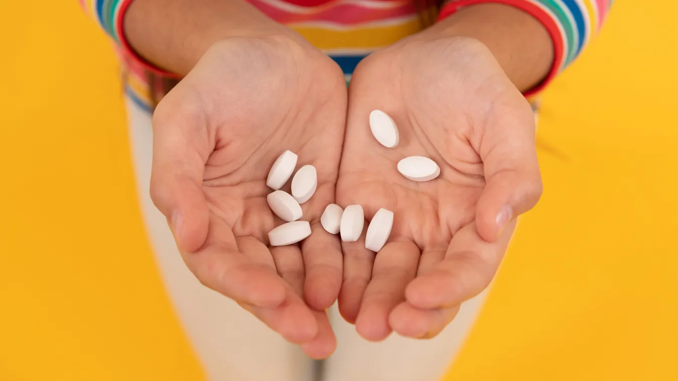 Hands,Of,Teen,Girl,Presenting,Natural,Food,Additives,Or,Vitamin