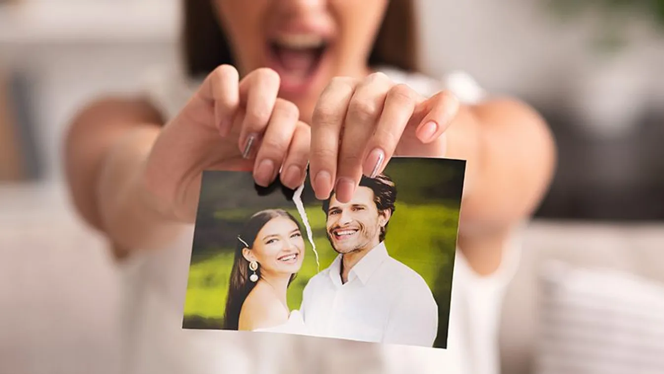 Breakup.,Furious,Woman,Ripping,Wedding,Photo,With,Ex-husband,Sitting,On