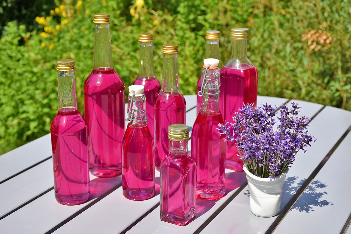Homemade,Lavender,Syrup,In,Glass,Bottles,And,A,Bouquet,Of