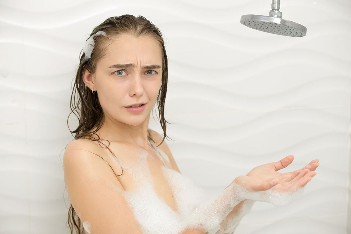Worried,Foamed,Young,Woman,After,The,Water,In,The,Shower