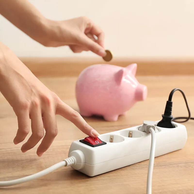 Woman,Pressing,A,Power,Button,Of,Extension,Cord,Indoors.,Electricity
