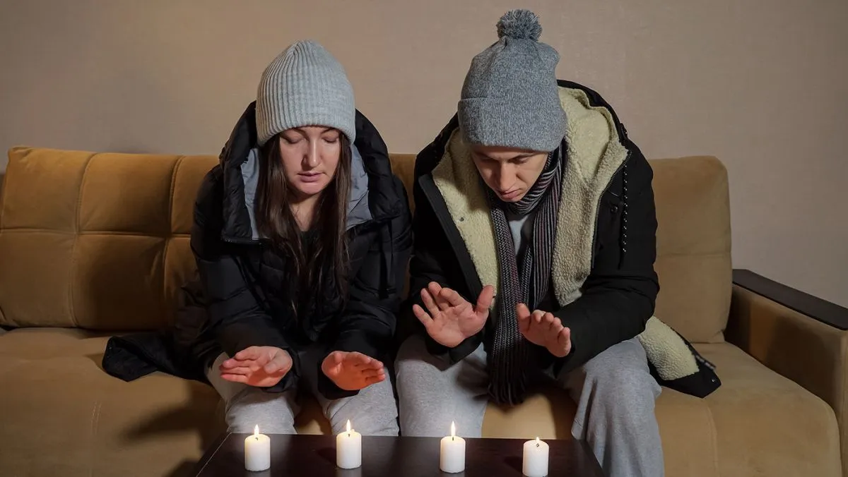 Sad,Frozen,Couple,In,Warm,Jackets,Tries,To,Heat,Palms