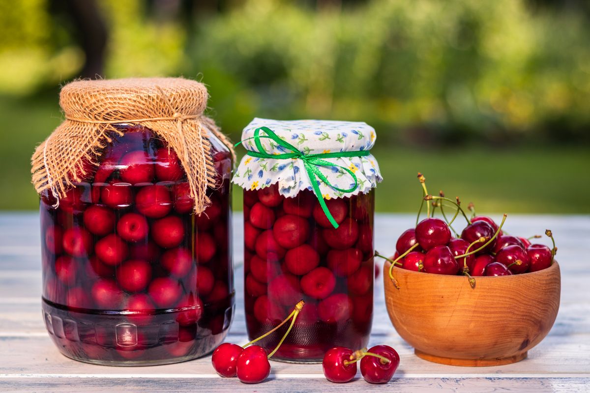 Homemade,Cherry,Fruit,Compote,In,Glass,Jar,And,Fresh,Harvested
